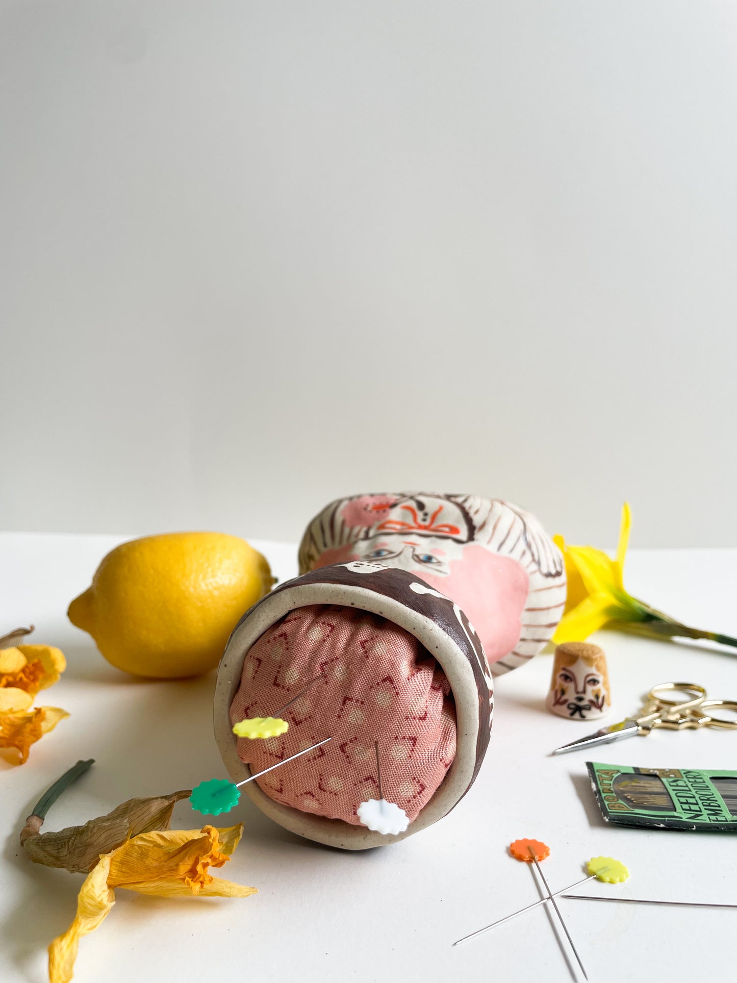Folk lady pin cushion figurine