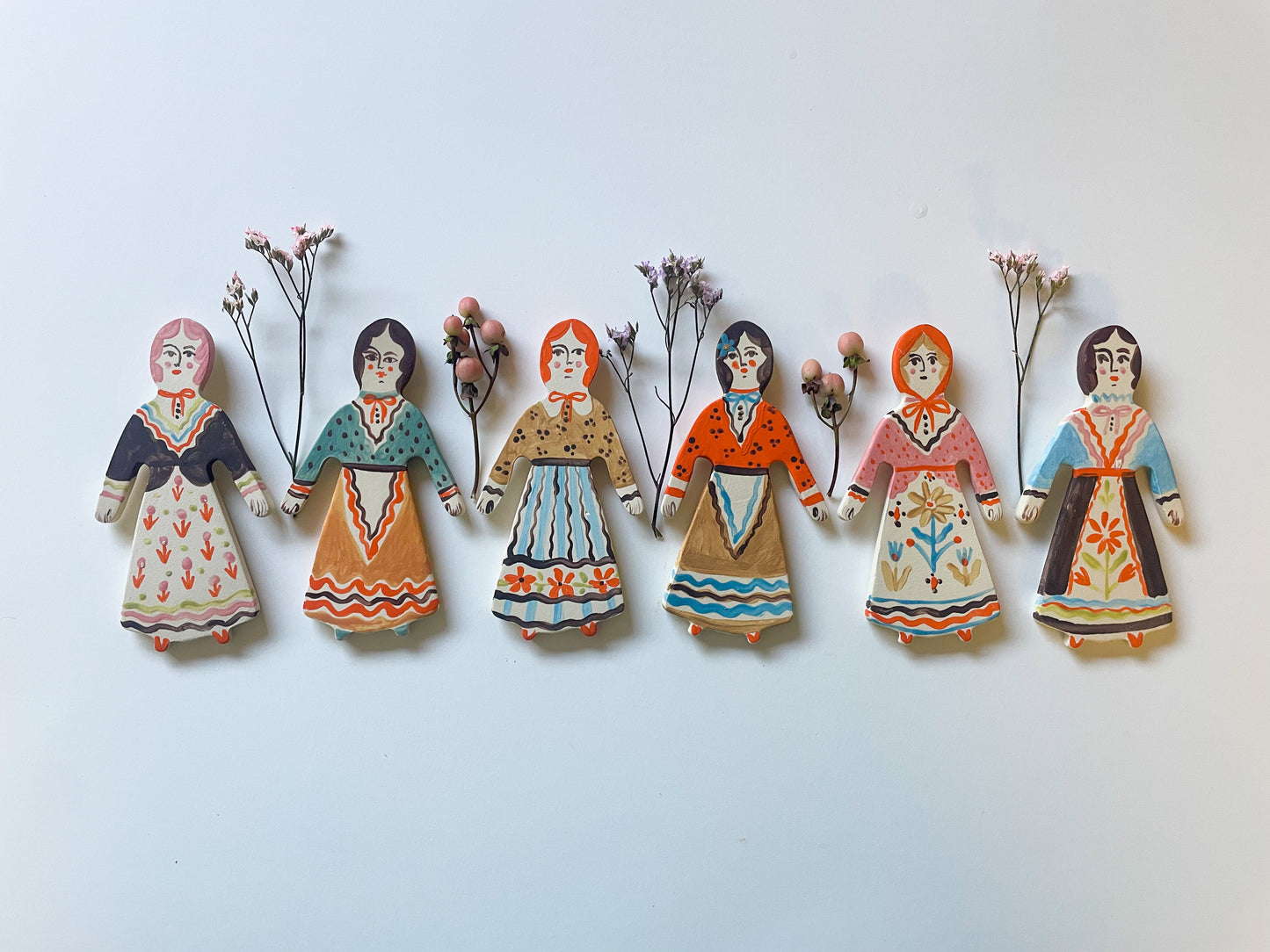 Clay doll wall ornament