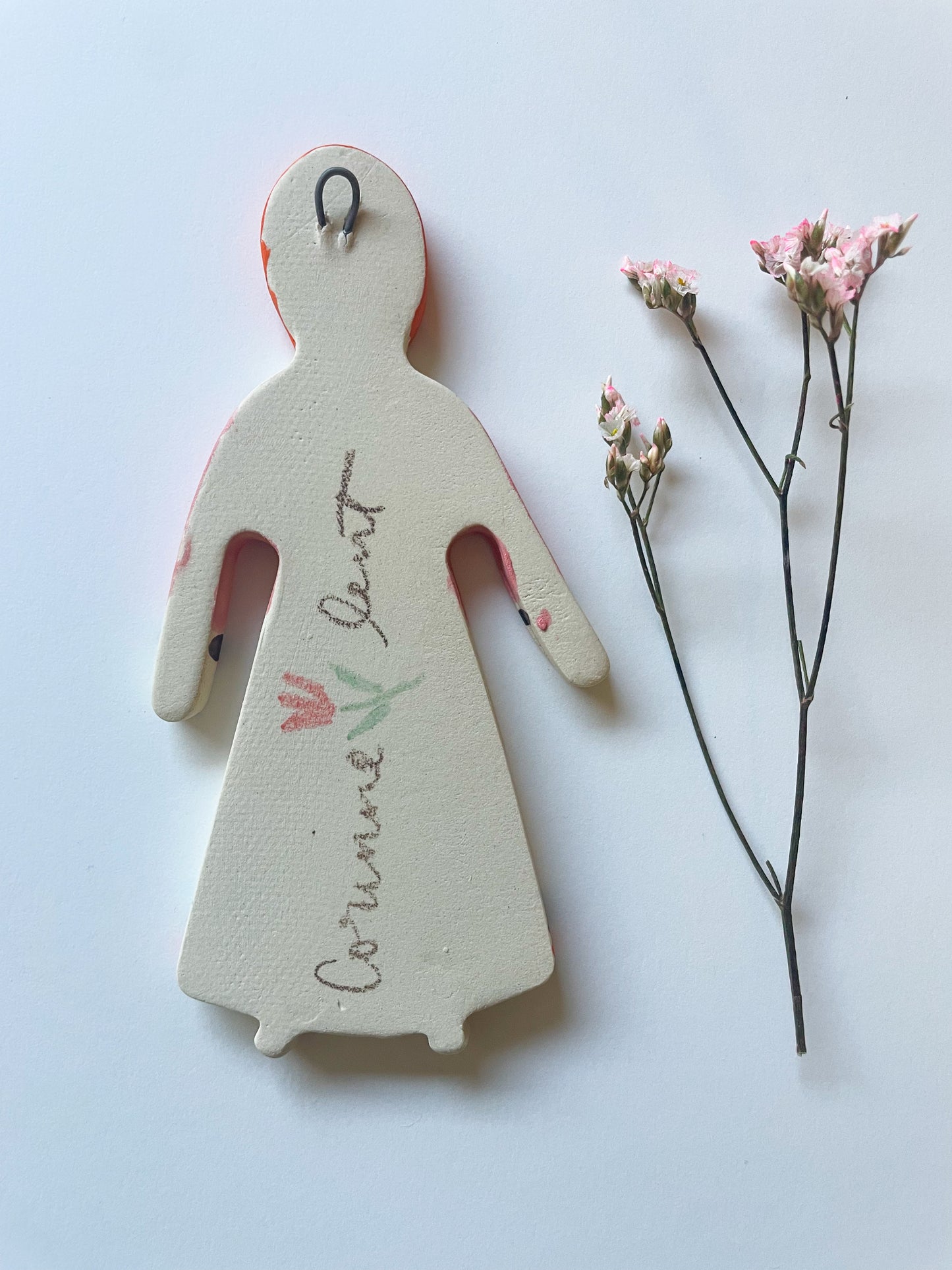Clay doll wall ornament