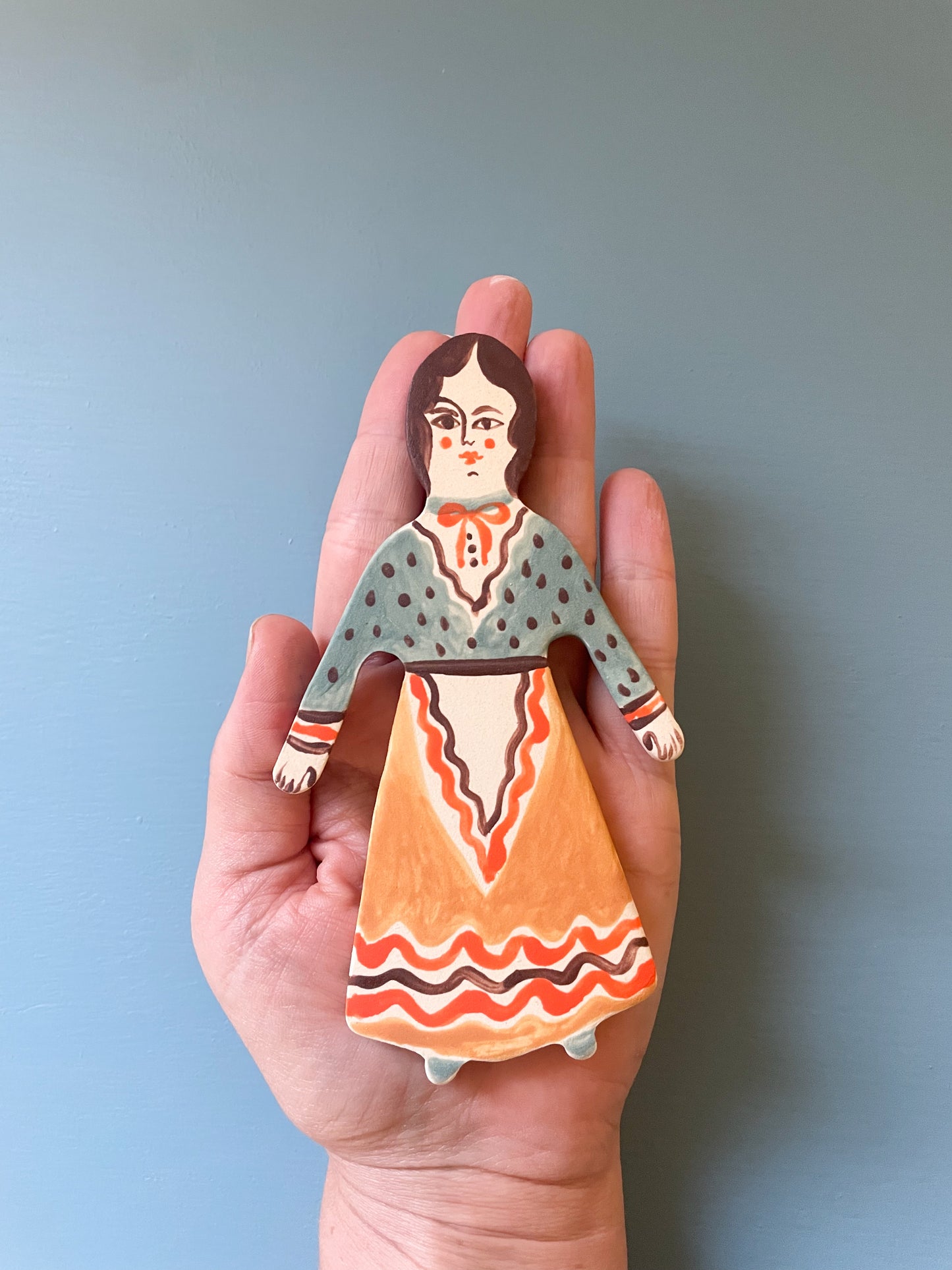 Clay doll wall ornament