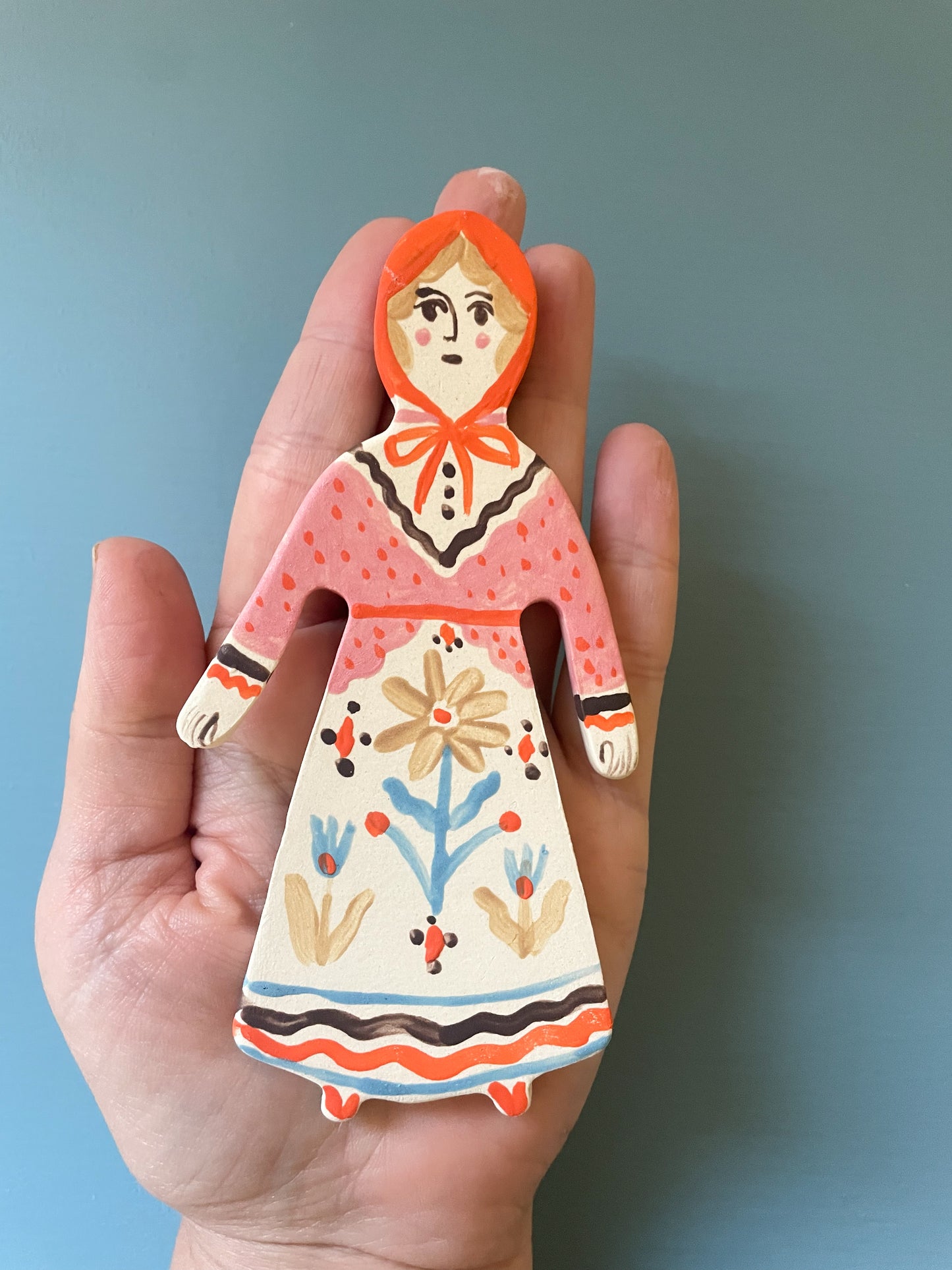 Clay doll wall ornament