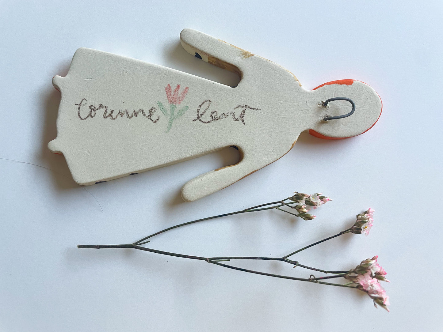 Clay doll wall ornament