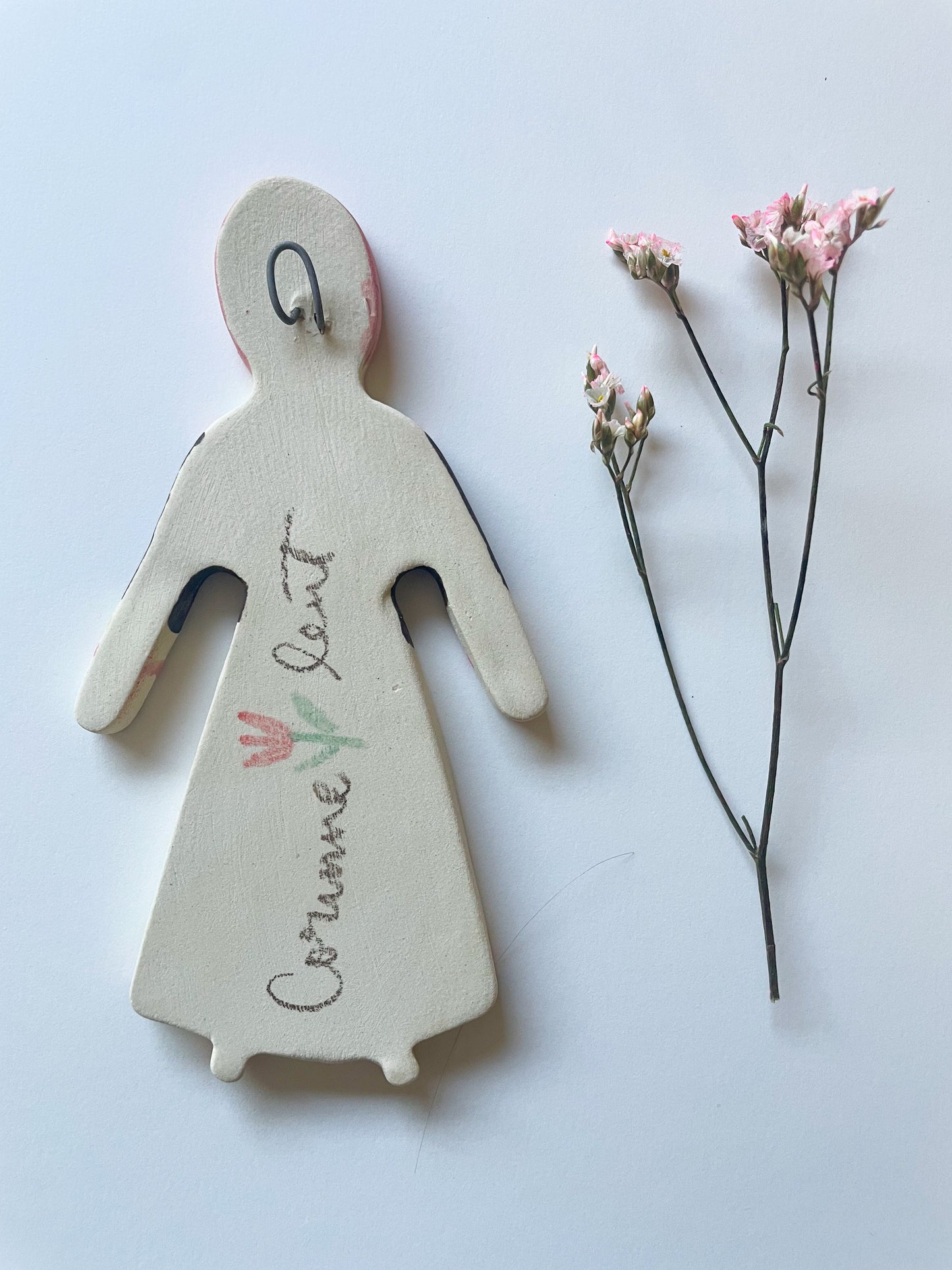 Clay doll wall ornament