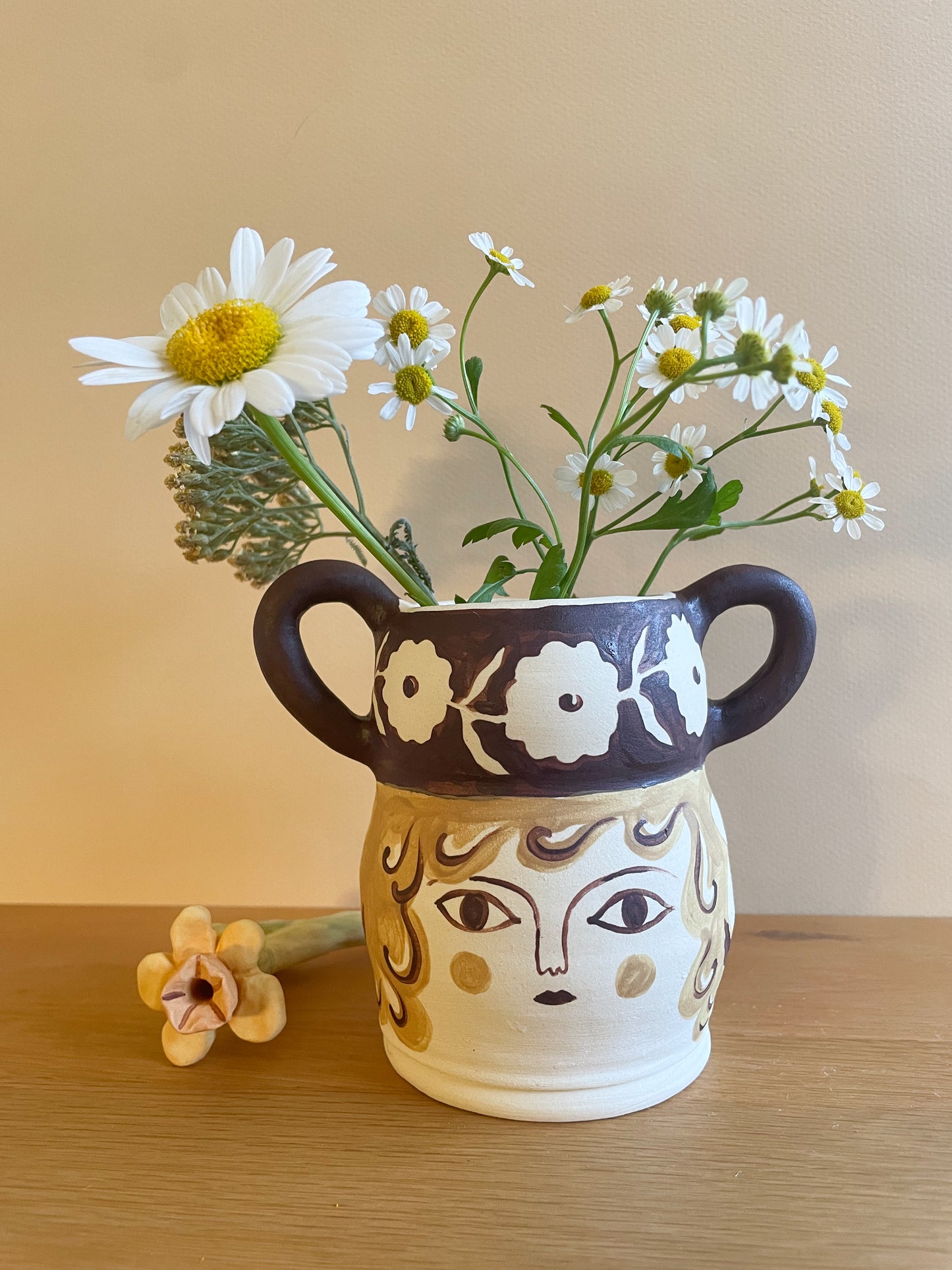 Pot head vase