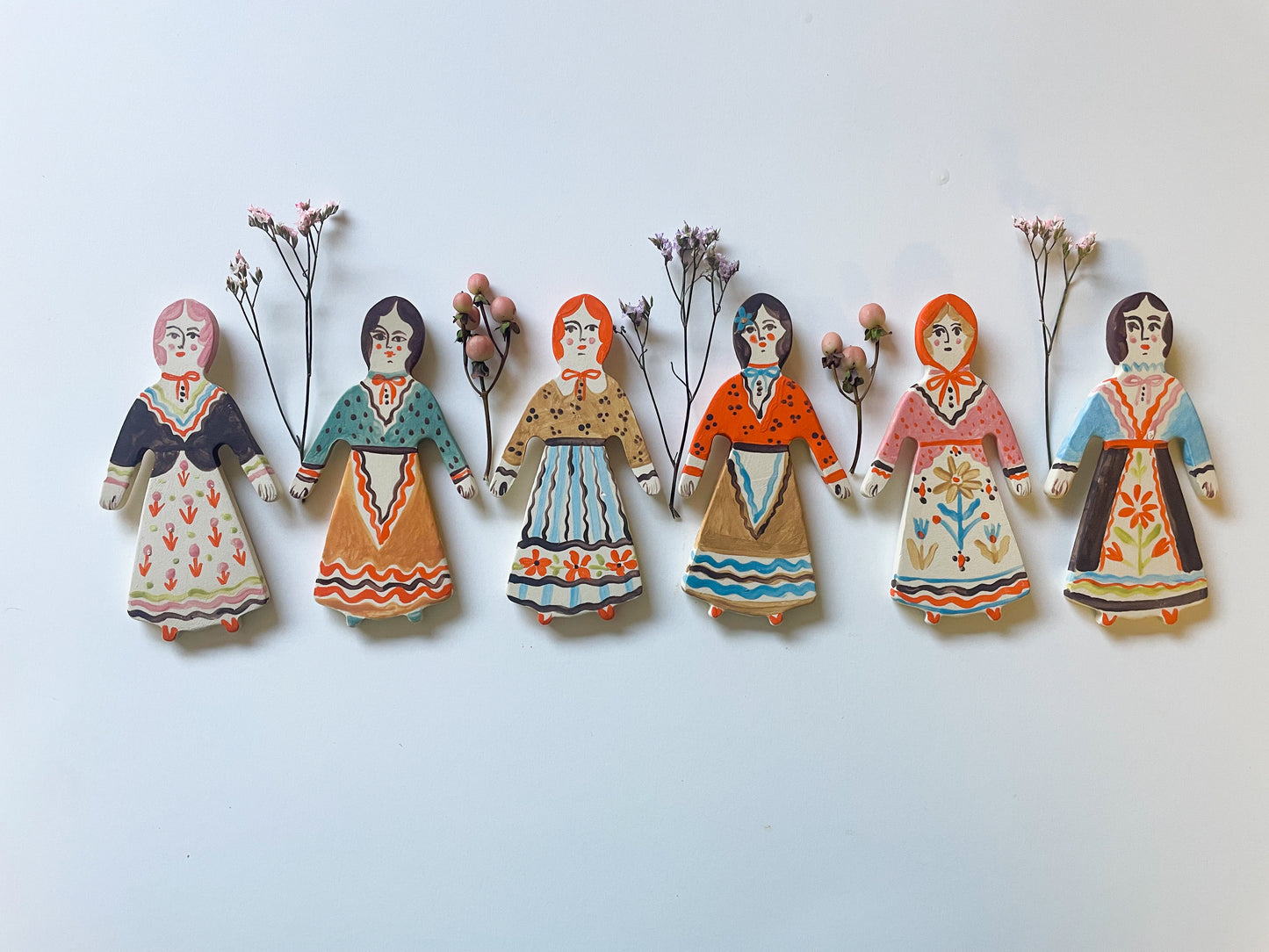 Clay doll wall ornament