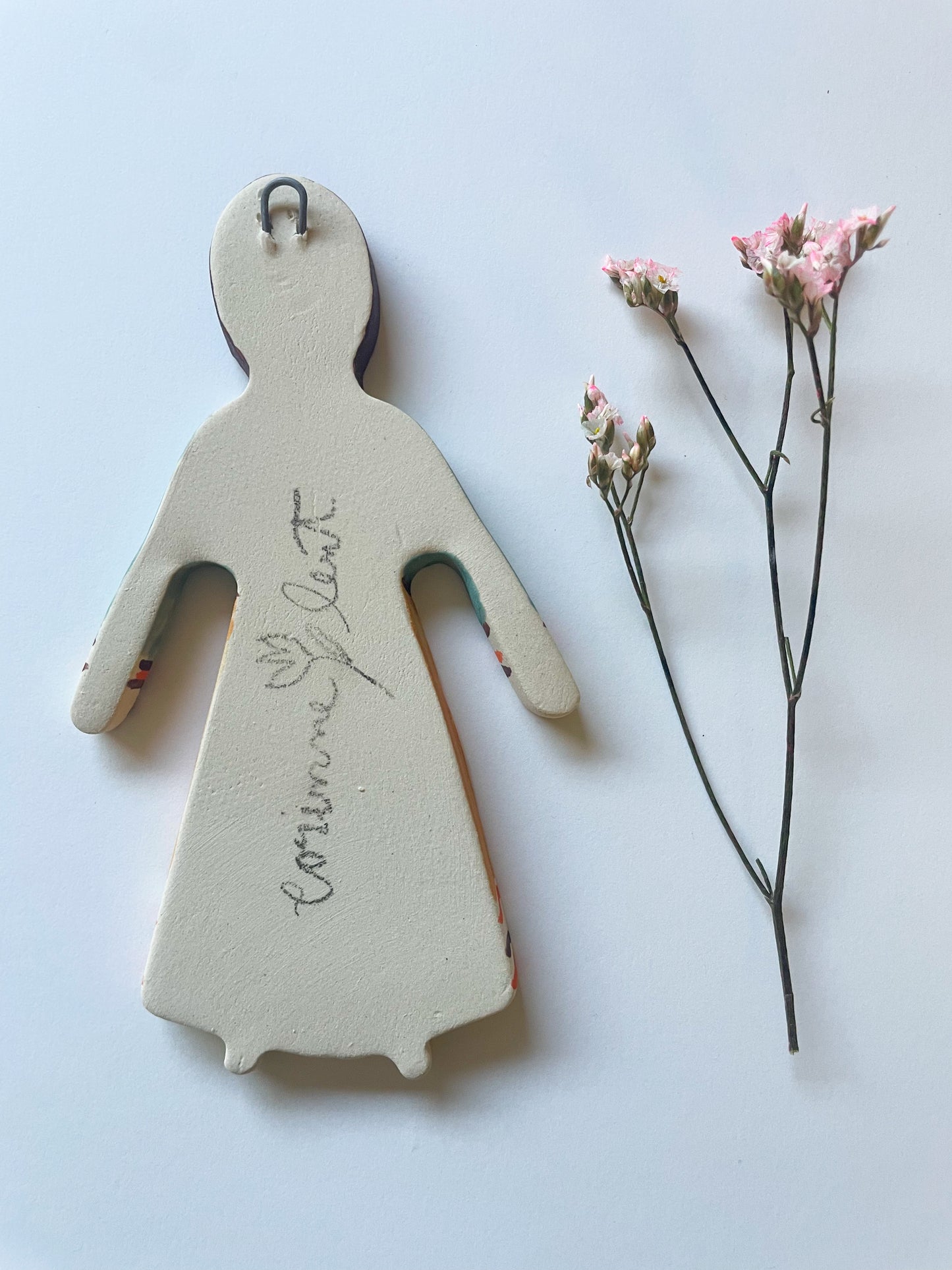 Clay doll wall ornament