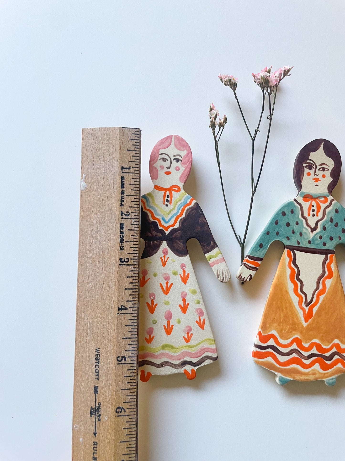 Clay doll wall ornament