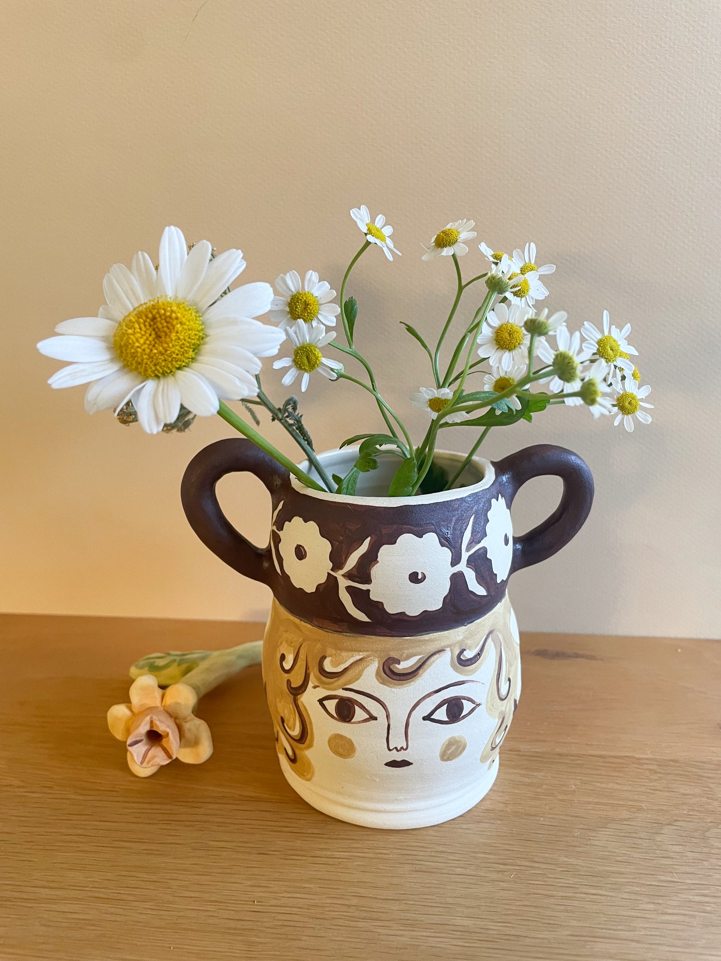 Pot head vase