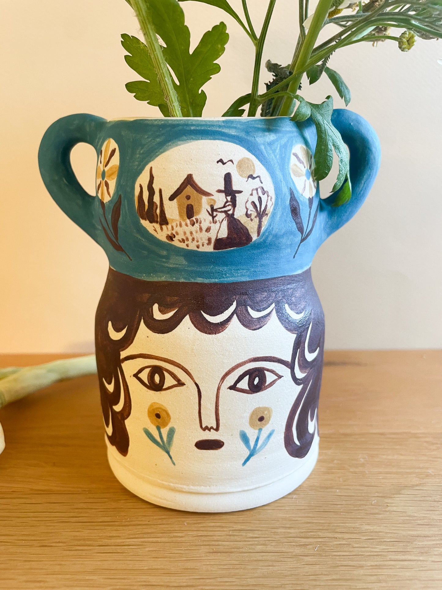 Pot head vase