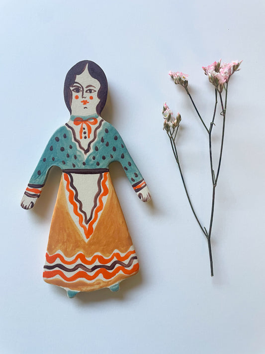 Clay doll wall ornament