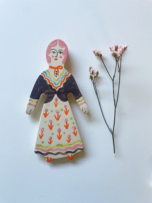 Clay doll wall ornament