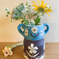 Pot head vase