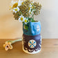 Pot head vase
