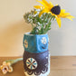 Pot head vase