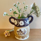 Pot head vase