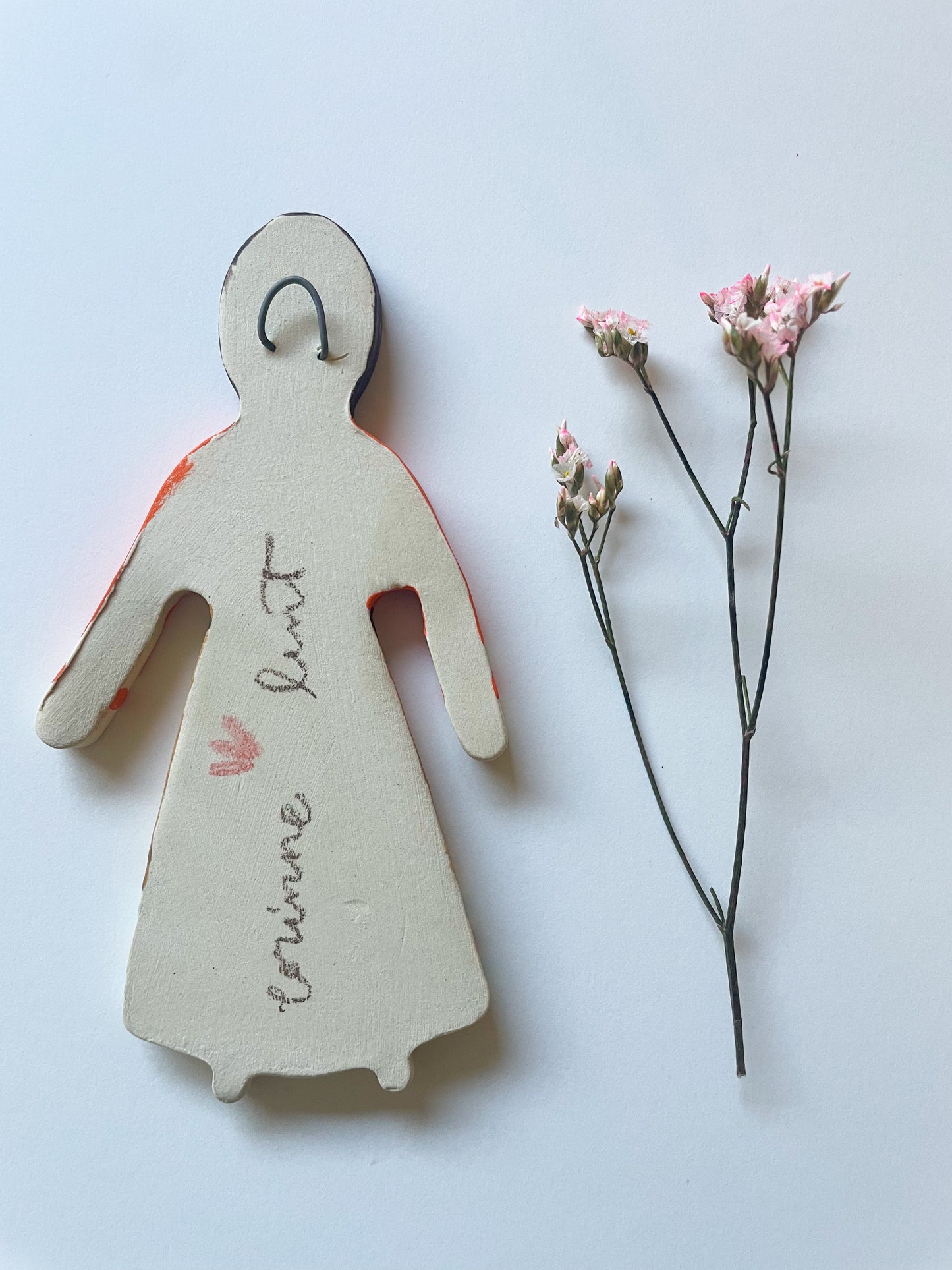 Clay doll wall ornament