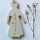Clay doll wall ornament