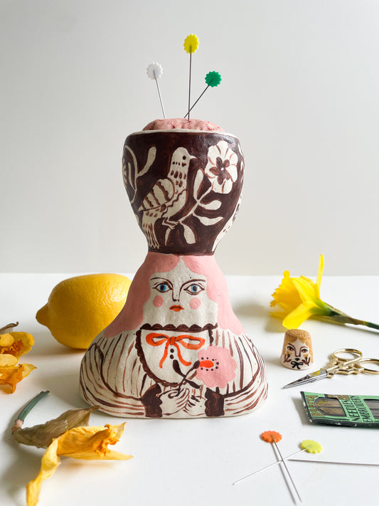 Folk lady pin cushion figurine