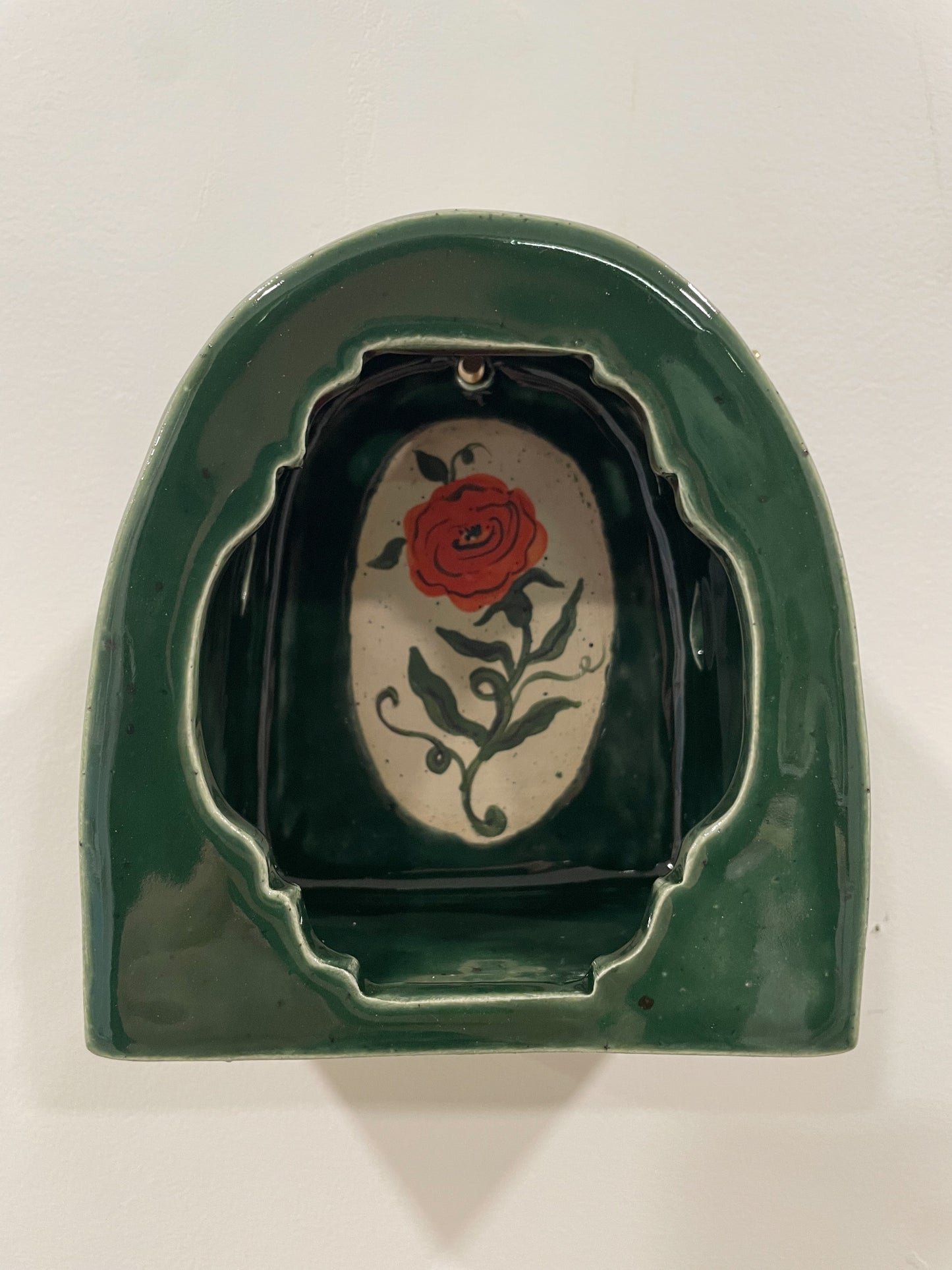 Glowing rose wall shrine