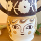 Pot head vase