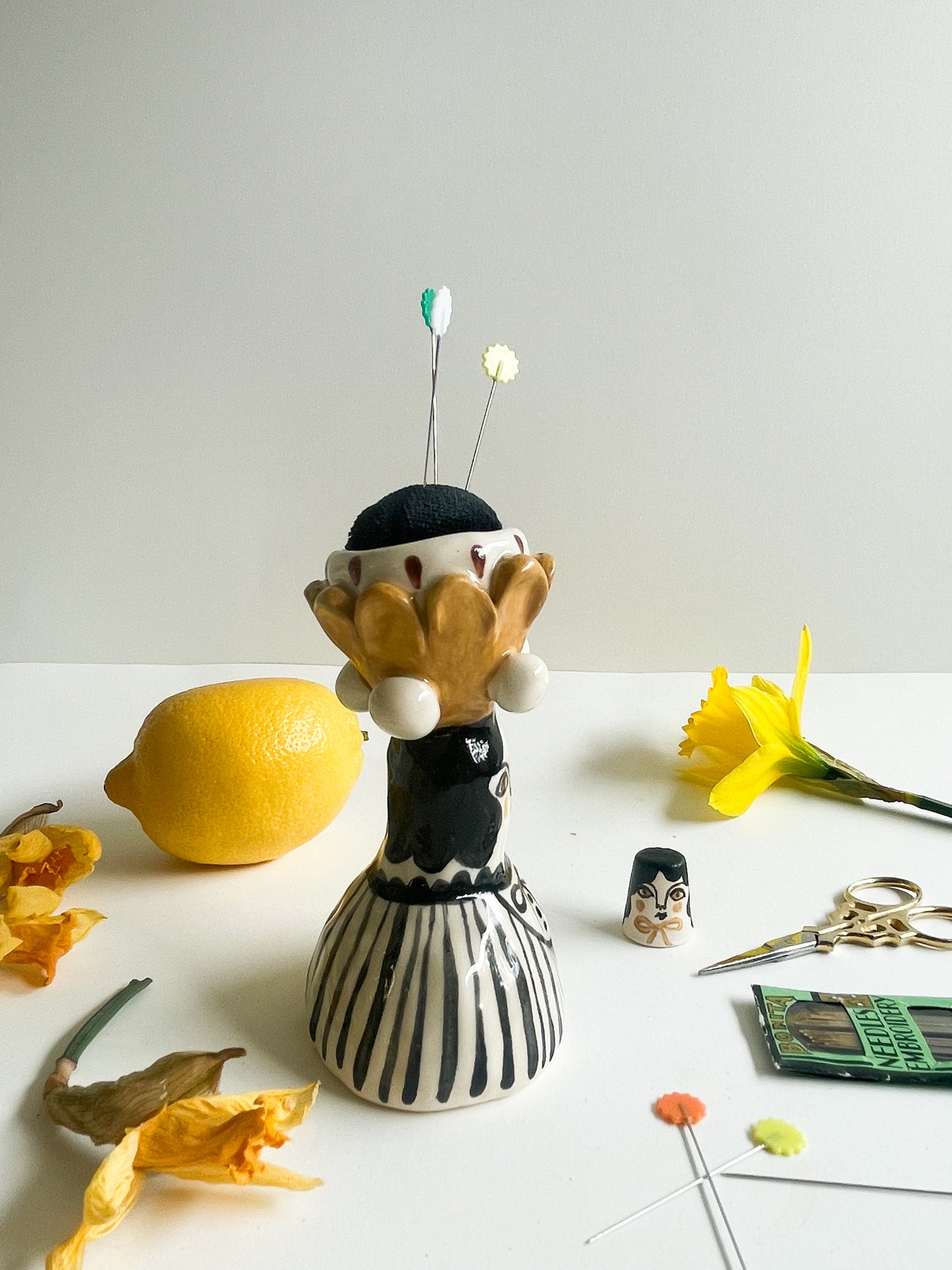 Folk lady pin cushion figurine