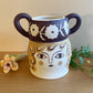 Pot head vase