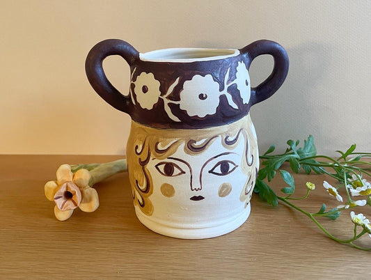 Pot head vase
