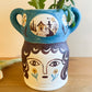 Pot head vase