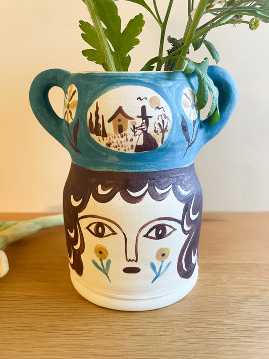 Pot head vase