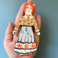 Clay doll wall ornament