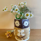 Pot head vase