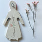 Clay doll wall ornament