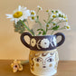 Pot head vase