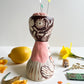 Folk lady pin cushion figurine