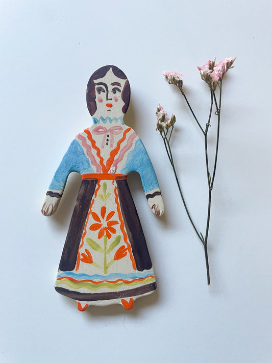 Clay doll wall ornament
