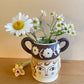 Pot head vase