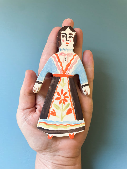 Clay doll wall ornament