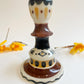 Folk people candlestick *seconds