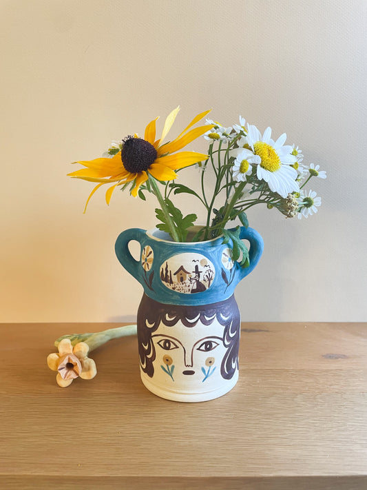 Pot head vase