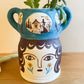 Pot head vase