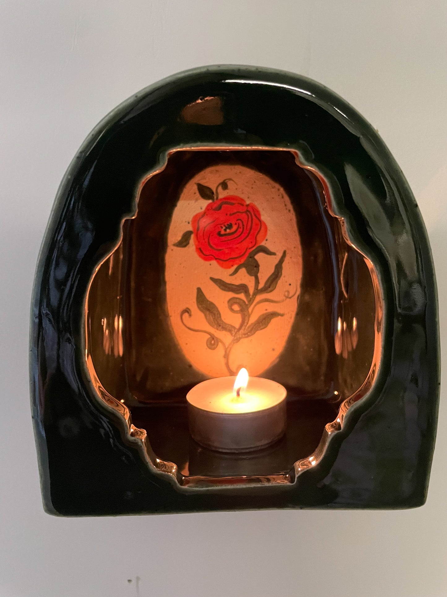 Glowing rose wall shrine
